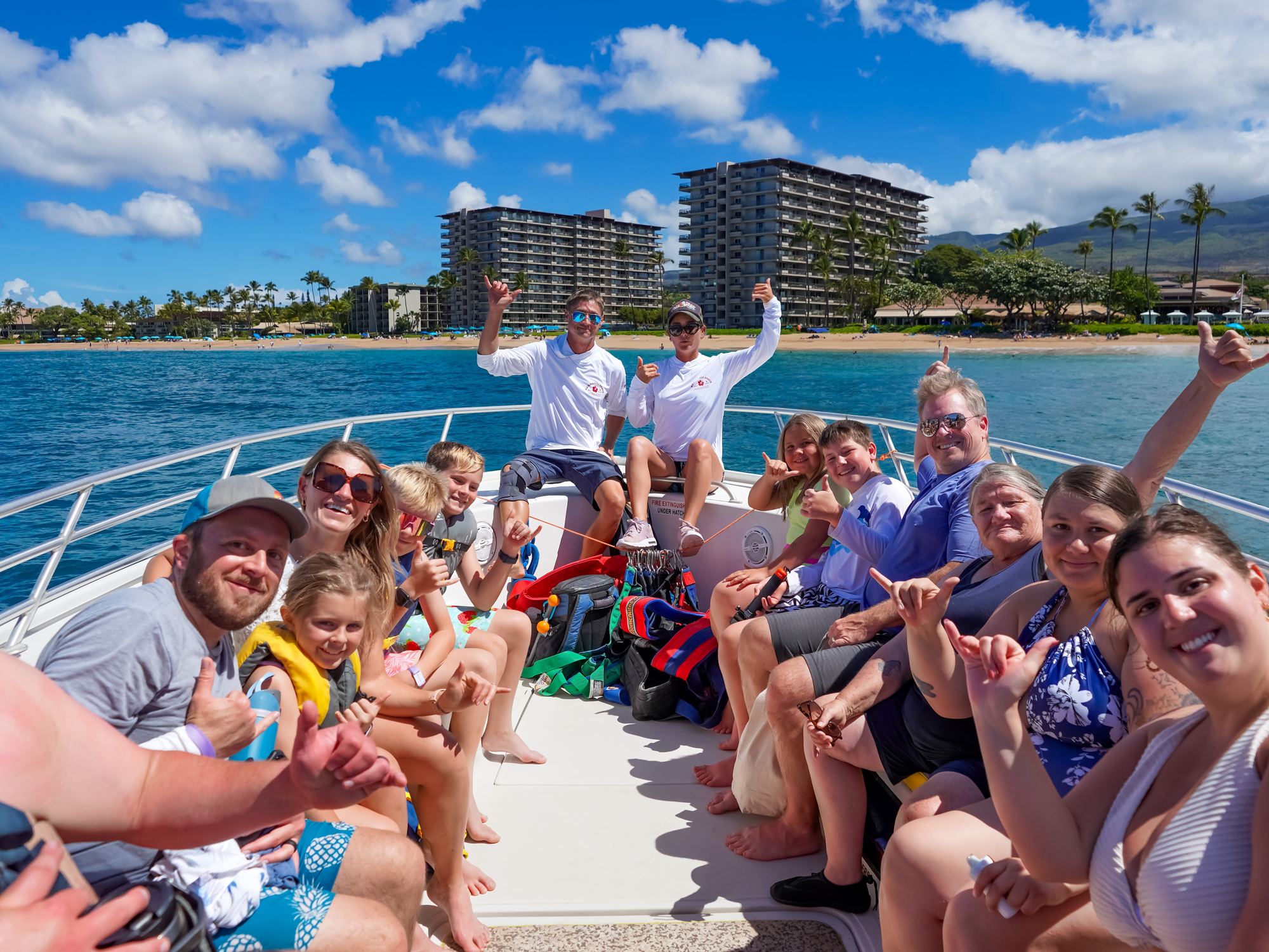 A full boat of guests with Kāʻanapali Beach behind