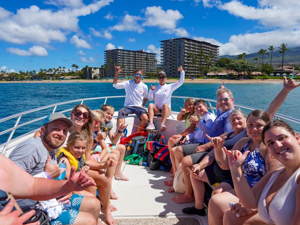 A full boat of guests with Kāʻanapali Beach behind