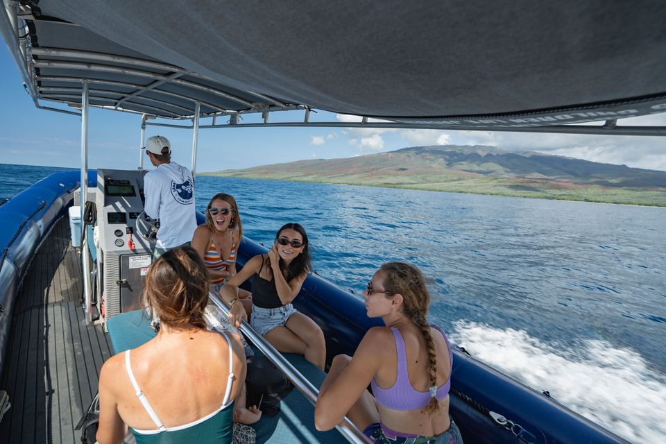 Guests aboard the Maui Whale Adventures raft off the West Maui coast